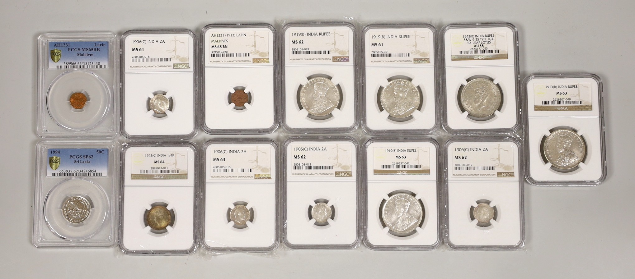 British India coins, NGC slabbed and graded - 1 rupee 1943 B, type D/4 six leaf lotus, AU58, four 1 rupee 1913 B, 3 x 1919 B, four 2 annas, 3 x 1906 C and 1905 C and a quarter rupee 1942 C together with PCGS and NGS slab